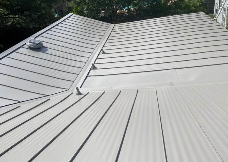 Solar attic fan installed on a metal roof for Roof Ventilation in Little Rock